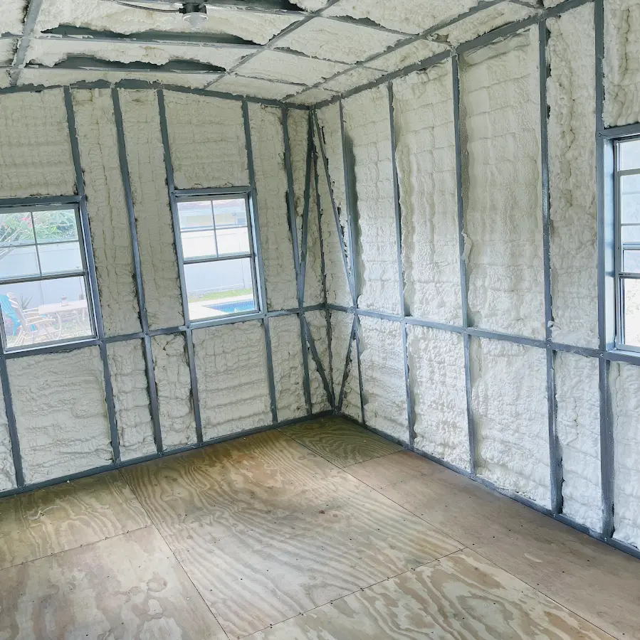 Closed-cell spray foam insulation applied to wall cavities in a residential project in Carmel